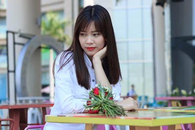 anxious Woman sitting in a cafe