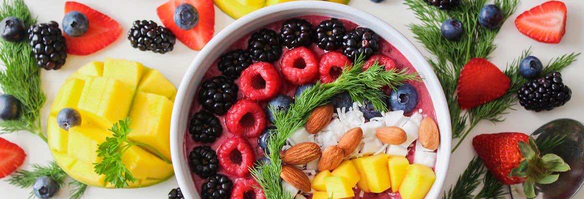 a bowl filled with colourful fruits | vegan blood test | London Doctors Clinic